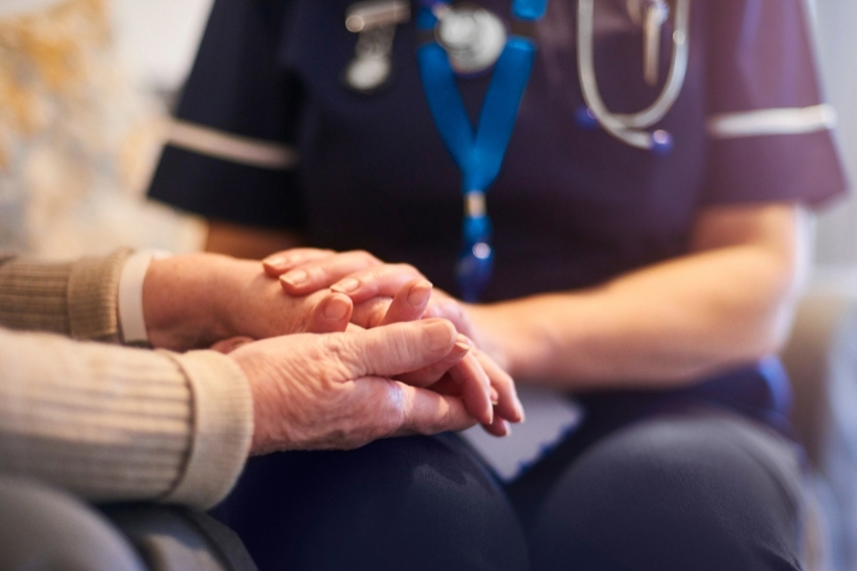 nurses insurance - nurse holding patient hand
